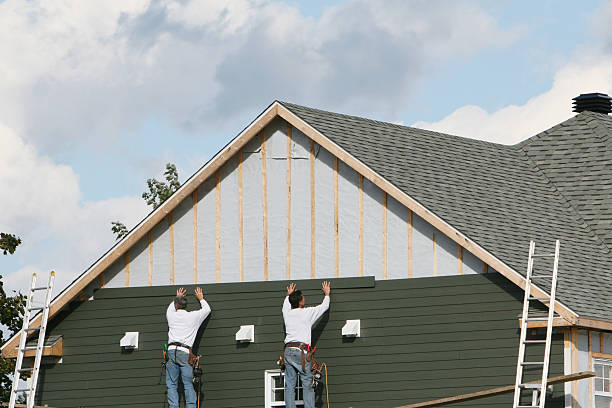 Professional Siding technician working in Efland, NC